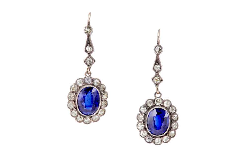 Lot 42 - A PAIR OF SYNTHETIC SAPPHIRE AND DIAMOND CLUSTER PENDENT EARRINGS