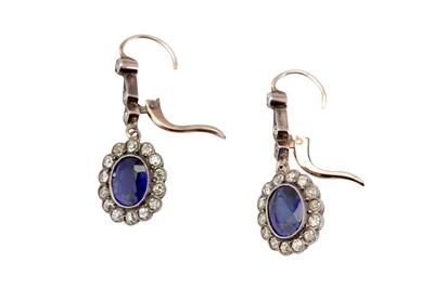 Lot 42 - A pair of synthetic sapphire and diamond cluster pendent earrings