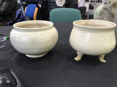 Lot 497 - TWO CHINESE CREAM-GLAZED POTTERY PIECES.