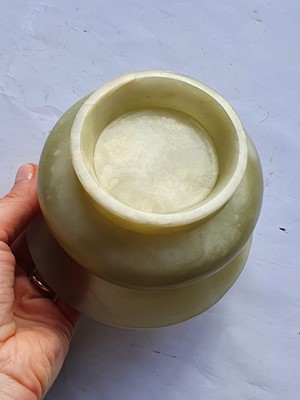 Lot 24 - A CHINESE PALE CELADON JADE SPITTOON, ZHADOU.