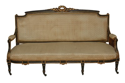 Lot 245 - A  FRENCH EBONISED AND GILTWOOD SOFA, 19TH CENTURY