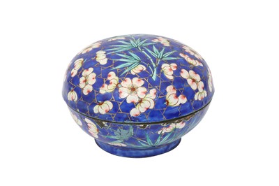 Lot 714 - A CHINESE BLUE-GROUND CANTON ENAMEL 'PRUNUS AND BAMBOO' BOX AND COVER.