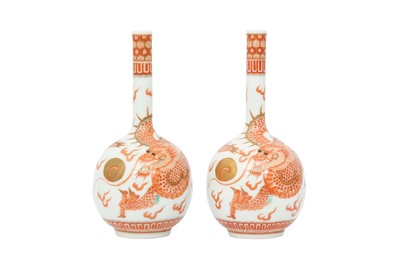 Lot 454 - A PAIR OF CHINESE IRON-RED 'DRAGON' BOTTLE VASES.