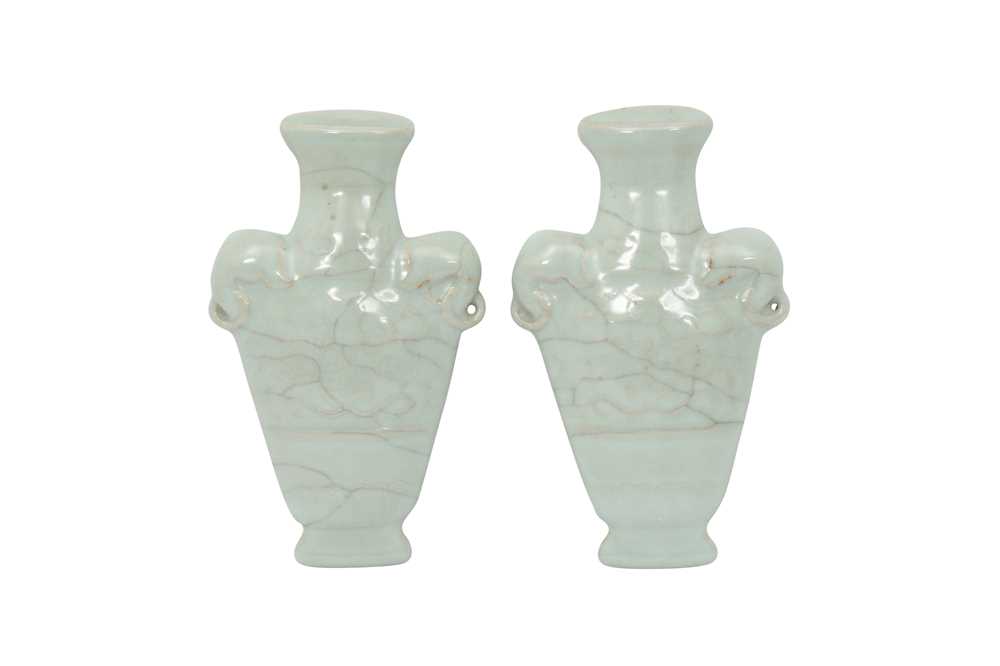 Lot 107 - A PAIR OF CHINESE CELADON-GLAZED 'WALL VASE' PLAQUES.