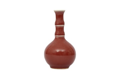 Lot 47 - A SMALL CHINESE SANG-DE-BOEUF BOTTLE VASE.