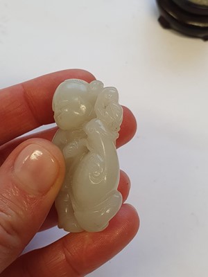 Lot 441 - A CHINESE WHITE JADE 'BOY AND GOOSE' CARVING.