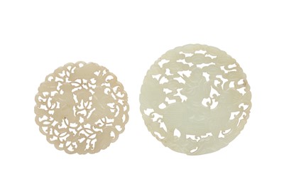 Lot 444 - TWO CHINESE PALE CELADON JADE CIRCULAR PLAQUES.
