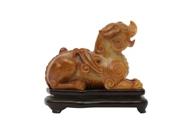 Lot 81 - A CHINESE SOAPSTONE ARCHAISTIC 'MYTHICAL BEAST' CARVING.