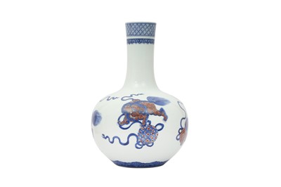 Lot 472 - A CHINESE BLUE AND WHITE AND UNDERGLAZE RED 'LION DOGS' BOTTLE VASE, TIANQIUPING.