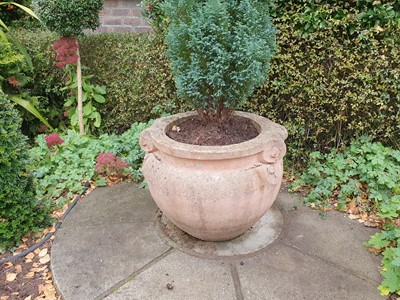 Lot 48 - A RECONSTITUTED STONE GARDEN PLANTER OF TERRACOTTA HUE