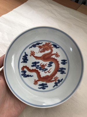 Lot 247 - A CHINESE BLUE AND WHITE AND IRON-RED 'DRAGON' DISH.