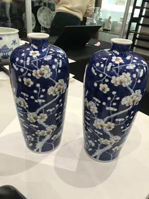 Lot 277 - A PAIR OF BLUE AND WHITE AND UNDERGLAZE RED 'PRUNUS' VASES.