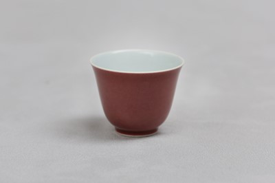 Lot 77 - A CHINESE COPPER RED-GLAZED CUP.