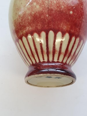 Lot 48 - A CHINESE PEACH BLOOM-GLAZED VASE AND A PINK-ENAMELLED VASE.