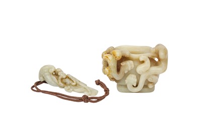Lot 178 - A CHINESE PALE CELADON JADE 'QILONG' CUP AND PENDANT.