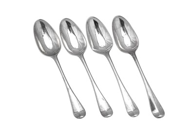 Lot 306 - A set of four George II sterling silver dessert spoons, London 1754 by Ebenezer Coker