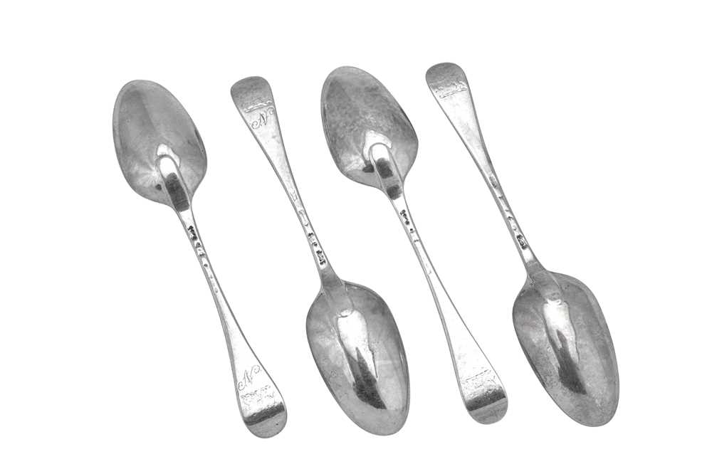 Lot 306 - A set of four George II sterling silver dessert spoons, London 1754 by Ebenezer Coker