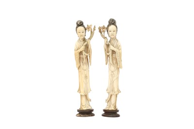 Lot 458 - λ A PAIR OF CHINESE IVORY FIGURES OF LADIES.