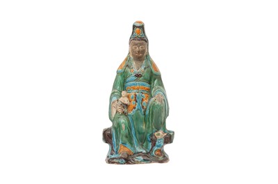 Lot 266 - A CHINESE FAHUA-GLAZED GUANYIN AND CHILD GROUP.