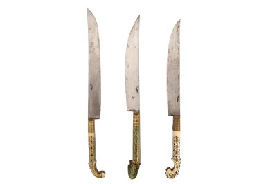 Lot 522 - A SET OF THREE BALKAN BONE-HILTED AND BRASS-MOUNTED KNIVES