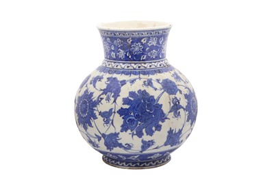 Lot 313 - A BLUE AND WHITE IZNIK-REVIVAL POTTERY VASE WITH CHINESE-INSPIRED LOTUS MOTIF