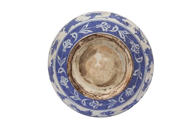 Lot 313 - A BLUE AND WHITE IZNIK-REVIVAL POTTERY VASE WITH CHINESE-INSPIRED LOTUS MOTIF