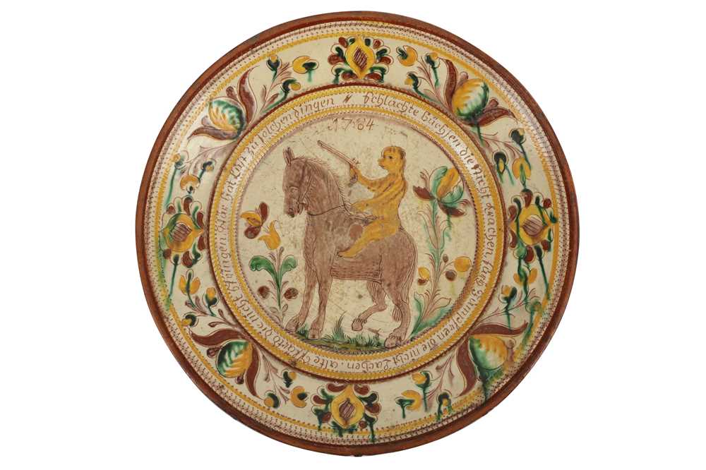 Lot 225 - A GERMAN POTTERY PLATE, PROBABLY 18TH CENTURY