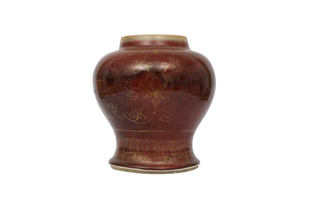 Lot 40 - A CHINESE GILT-DECORATED COPPER RED-GLAZED VASE.