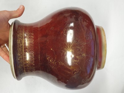 Lot 40 - A CHINESE GILT-DECORATED COPPER RED-GLAZED VASE.