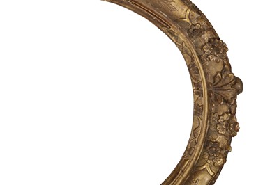 Lot 242 - A FRENCH OAK OVAL LE BRUN SEGMENTED WITH LEAF AND FLOWER HEAD CARVING AT CARDINAL POINTS WITH ENGRAVED FOLIATE REPOSEE PANELS AND DEMI-FLOWER OUTER EDGE FRAME