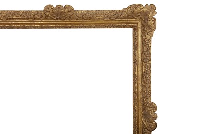Lot 244 - A FRENCH OAK RÈGENCE CARVED AND GILDED FRAME