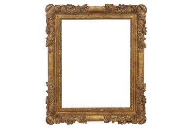 Lot 76 - A FRENCH 17TH CENTURY STYLE CARVED AND GILDED LIMEWOOD LE BRUN FRAME