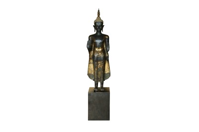 Lot 205 - A LARGE GILT BRONZE STANDING FIGURE OF THE HISTORICAL BUDDHA, SIDDHARTHA GAUTAMA SHAKYAMUNI