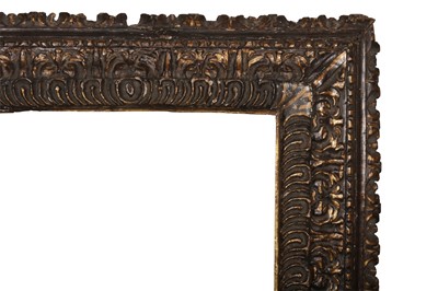 Lot 31 - AN IMPRESSIVE ITALIAN, 17TH CENTURY BOLOGNESE CARVED AND PARCEL GILT REVERSE PROFILE FRAME