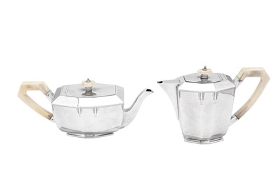 Lot 377 - A George V Art Deco sterling silver four-piece tea and coffee service, Sheffield 1935 by E Viner