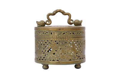 Lot 576 - AN ENGRAVED AND OPENWORK INDIAN BRASS LIDDED BOX