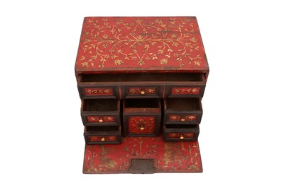 Lot 257 - A LACQUERED GOLD AND POLYCHROME-PAINTED TABLE CABINET