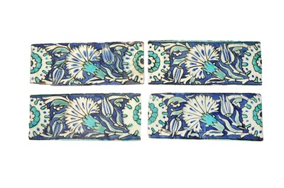 Lot 331 - FOUR POTTERY BORDER TILES WITH CARNATIONS AND ROSETTES