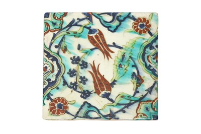 Lot 325 - AN IZNIK POTTERY TILE WITH A FLORAL SPRAY OF TULIPS, HYACINTHS AND ROSETTES