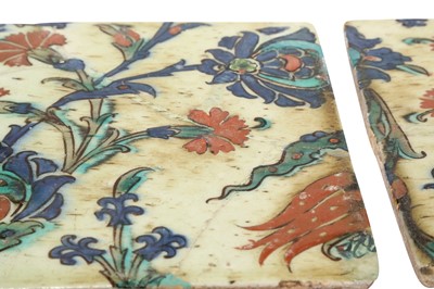 Lot 322 - TWO IZNIK POTTERY TILES WITH CARNATIONS, TULIPS AND LOTUS FLOWERS