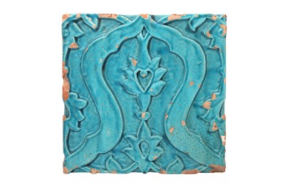 Lot 584 - A MOULDED TURQUOISE-GLAZED ARCHITECTURAL POTTERY TILE