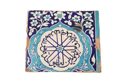 Lot 450 - A MULTAN POTTERY TILE WITH CALLIGRAPHIC MEDALLION