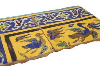 Lot 414 - THREE SAFAVID CUERDA SECA POTTERY TILES WITH ANIMALS