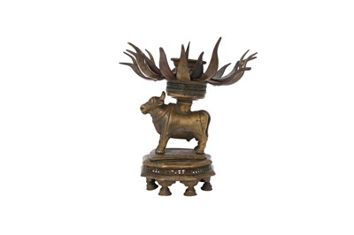 Lot 271 - A RITUAL BRASS CANDLE HOLDER WITH NANDI THE BULL