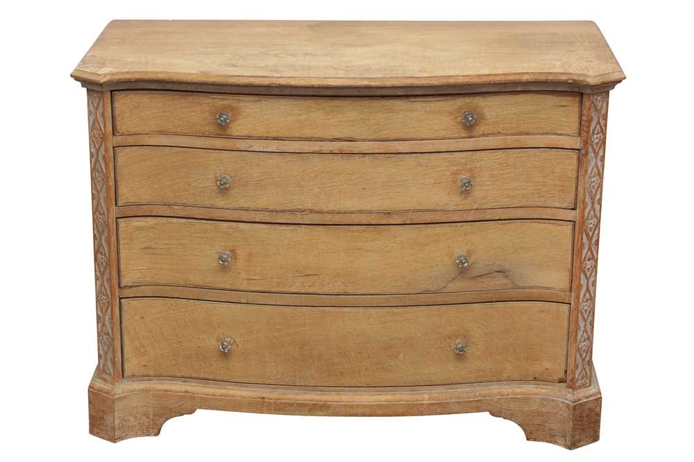 Lot 21 - AN ARTS AND CRAFTS STYLE LIMED OAK SERPENTINE CHEST OF DRAWERS