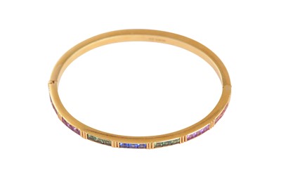 Lot 120 - A multi-coloured sapphire bangle