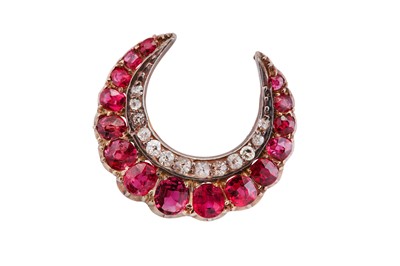 Lot 1 - A ruby and diamond crescent brooch