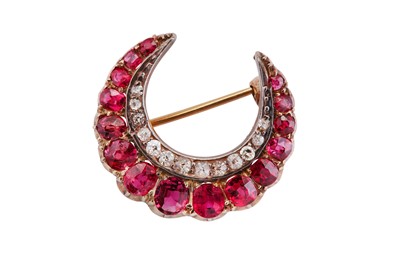 Lot 1 - A ruby and diamond crescent brooch