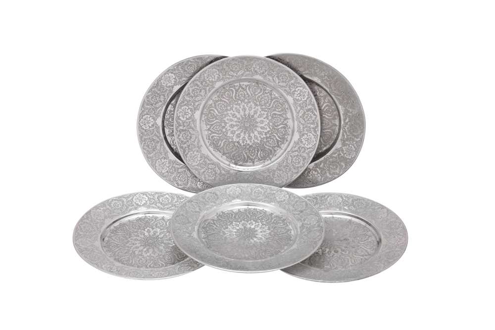 Lot 167 - A set of six mid- 20th century Iranian (Persian) silver underplates or dishes, Isfahan circa 1970 mark of Rabii, retailed by Pirayesh