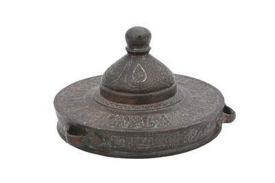 Lot 3 - A SELJUK SILVER AND COPPER-INLAID BRONZE INKWELL LID
